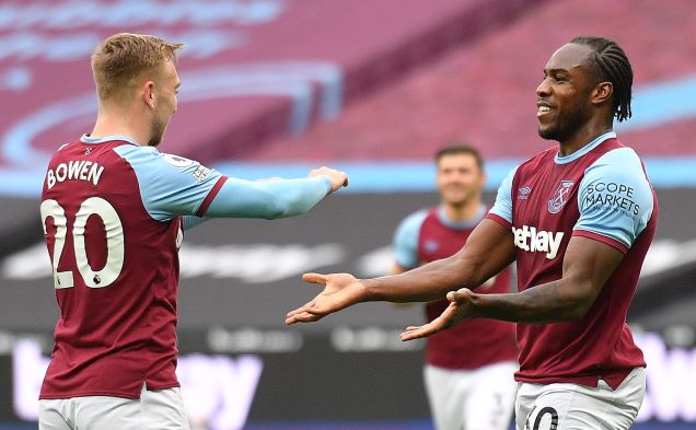 Michail Antonio on the pitch with teammates