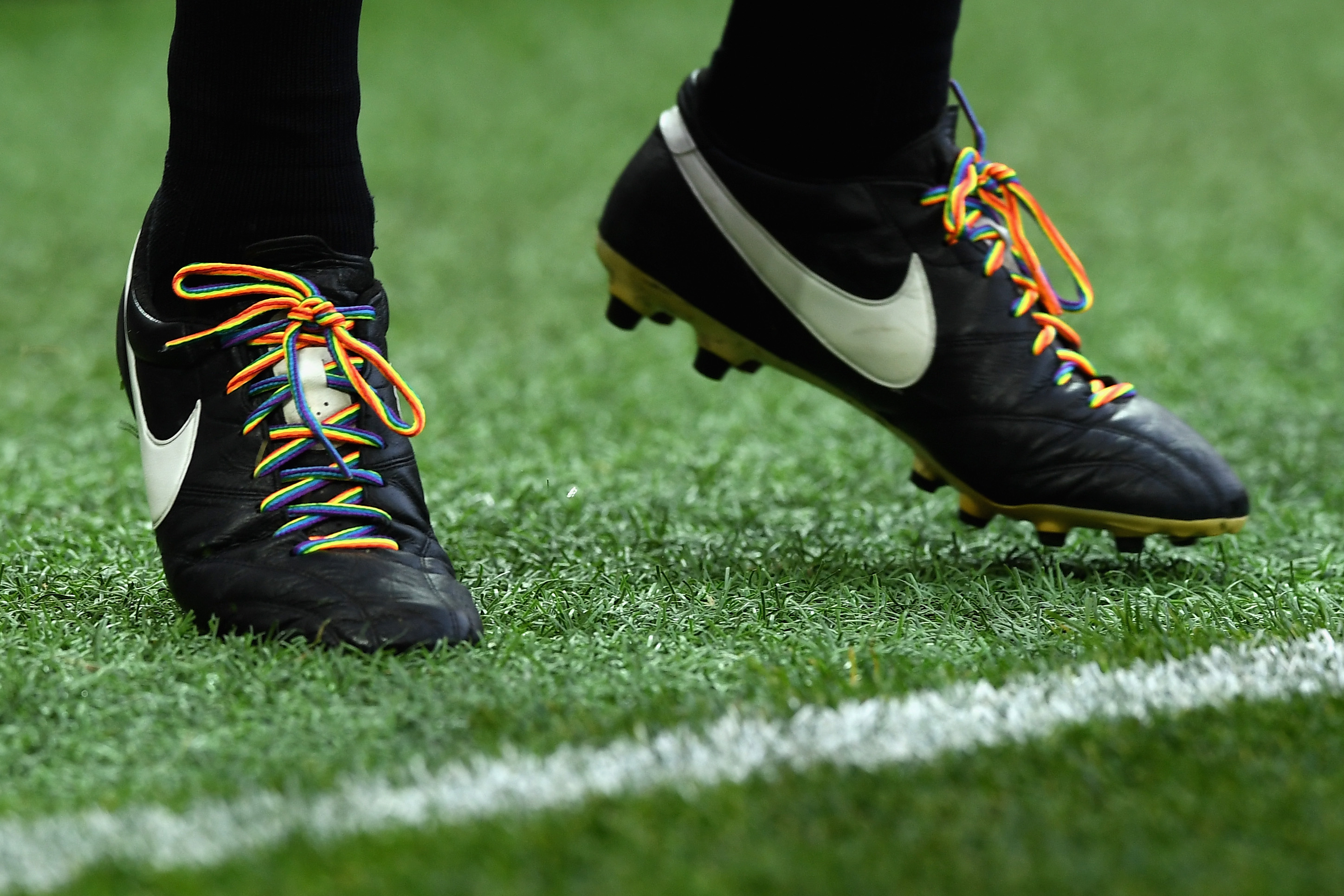 Image of football boots with rainbow laces.